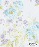Liberty Fabrics floral pattern featuring light blue and lavender peonies with pale green leaves on a white background, with the 'LIBERTY. FABRICS' logo in the bottom right corner.