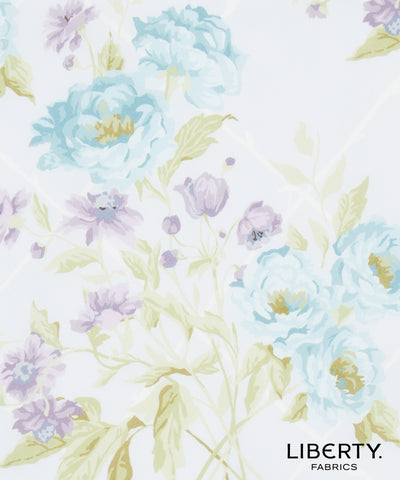 Liberty Fabrics floral pattern featuring light blue and lavender peonies with pale green leaves on a white background, with the 'LIBERTY. FABRICS' logo in the bottom right corner.