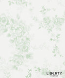 Liberty Fabrics floral pattern fabric featuring light sage green rose and leaf motifs on a warm off-white background, with the 'LIBERTY FABRICS' brand logo in the bottom right corner.