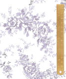 A close-up of a floral toile pattern in lavender and gray on a white background, with a wooden ruler along the right side for scale.