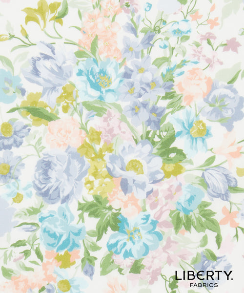 Liberty Fabrics floral pattern featuring light blue, lavender, peach, and yellow flowers with green leaves on a white background, with the 'LIBERTY. FABRICS' logo in the bottom right corner.