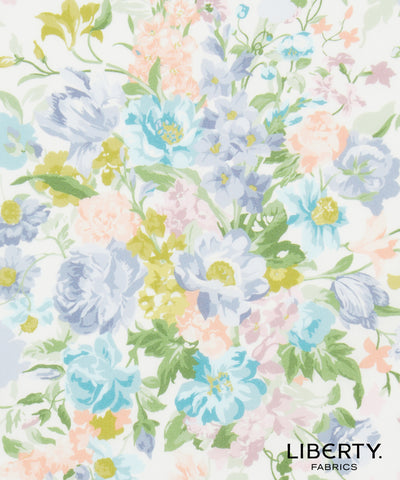Liberty Fabrics floral pattern featuring light blue, lavender, peach, and yellow flowers with green leaves on a white background, with the 'LIBERTY. FABRICS' logo in the bottom right corner.