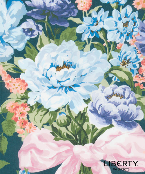 Floral pattern with blue and pink flowers on a dark background, featuring the Liberty Fabrics logo.