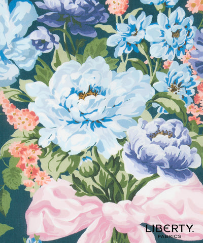 Floral pattern with blue and pink flowers on a dark background, featuring the Liberty Fabrics logo.