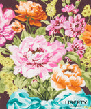 A close-up of Liberty Fabrics floral pattern featuring large pink and orange flowers with green leaves on a dark background, with the Liberty Fabrics logo in the bottom right corner.