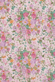 Portrait view of Liberty Tana Lawn fabric with pink, purple, orange and teal floral motifs on a pale pink background.